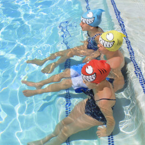 99033LsGroupSmilingPiranhaSiliconeSwimCapSittingOnStepsRGB800px